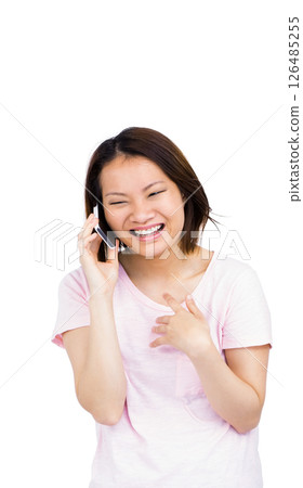 Smiling woman talking on smartphone, enjoying cheerful conversation at home 126485255