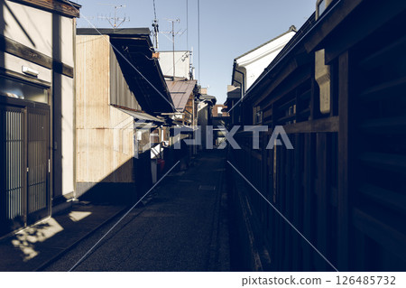 Retro-style street photo of Uramachi Takayama Japan showing traditional alley with wooden houses Retro-style street photo of Uramachi Takayama Japan showing traditional alley with wooden houses 126485732