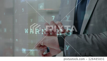 Checking smartwatch, businessman sees digital warning message in office setting 126485831