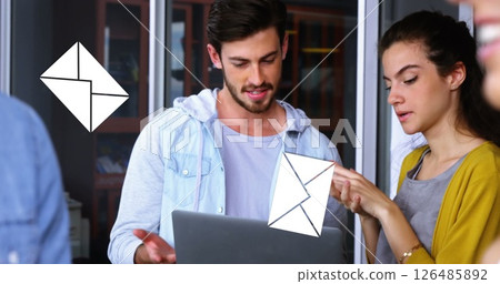 Image of a caucasian man discussing with his female coworker in the office with message icons Image of a caucasian man discussing with his female coworker in the office with message icons 126485892