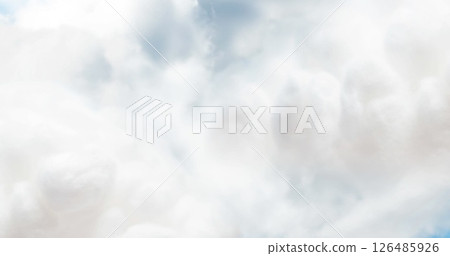 Fluffy white clouds floating gently across bright blue sky on sunny day 126485926