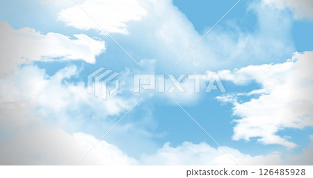 Bright blue sky with fluffy white clouds creating serene and peaceful scene 126485928