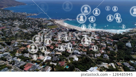 Aerial view of coastal town with digital social network icons overlaying community Aerial view of coastal town with digital social network icons overlaying community 126485945