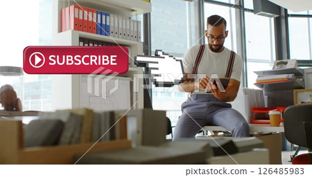 Man in office using tablet, surrounded by files, with subscribe button overlay Man in office using tablet, surrounded by files, with subscribe button overlay 126485983