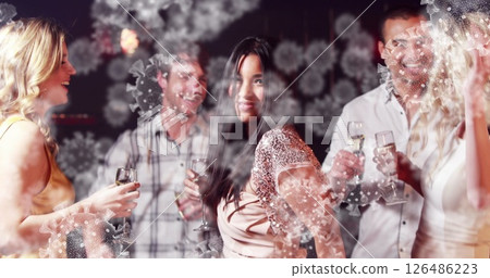 Image of cells floating over multi-ethnic group of people dancing and holding drinks 126486223