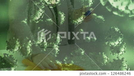 Person cleaning surface with disinfectant, focusing on hygiene and safety 126486246