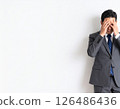 Worried expression of a stressed businessman 126486436