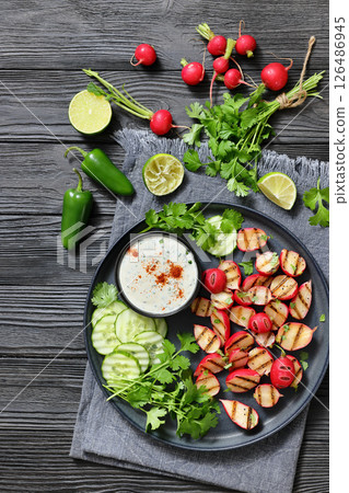 grilled radishes with cucumber slices and sauce grilled radishes with cucumber slices and sauce 126486945