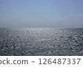 The sea is slightly choppy. 126487337