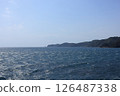The sea is slightly choppy. 126487338