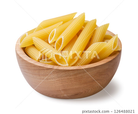 Raw pasta in a wooden plate on a white background. Isolated 126488021