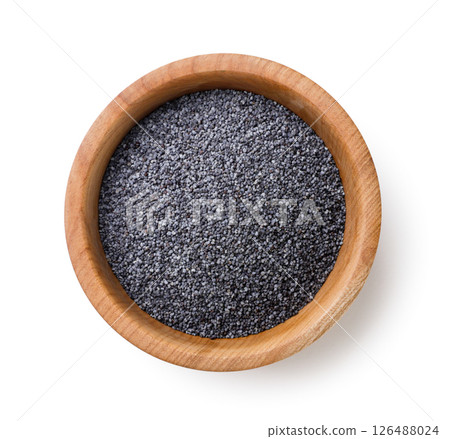 Poppy seeds in a wooden plate on a white background. Top view Poppy seeds in a wooden plate on a white background. Top view 126488024