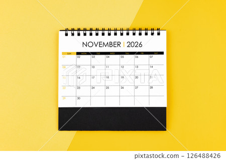 November desk calendar for 2026 year on yellow background for schedule to make appointment. November desk calendar for 2026 year on yellow background for schedule to make appointment. 126488426