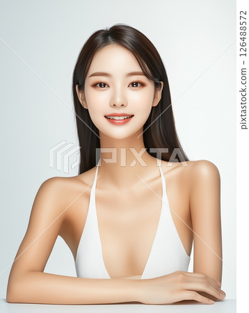 Korean woman with radiant skin poses confidently in a minimalistic setting showcasing natural beauty and skincare routine Korean woman with radiant skin poses confidently in a minimalistic setting showcasing natural beauty and skincare routine 126488572
