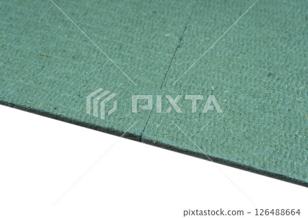 Pine Wood Fiber Underlayment for Laminate Flooring Isolated on White Background 126488664