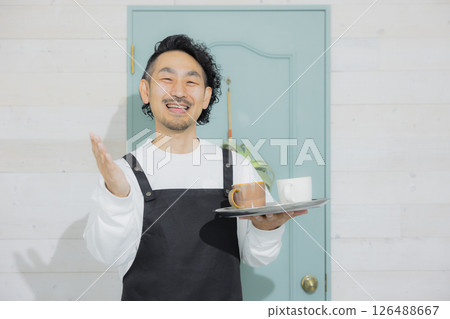 Bearded male cafe clerk 126488667