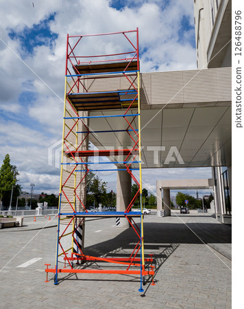 building is under construction, featuring scaffolding building is under construction, featuring scaffolding 126488796