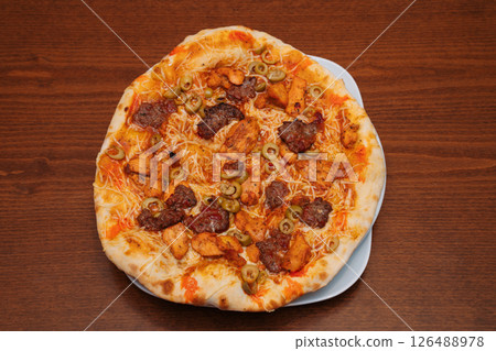 Curry pizza with meat and olives Curry pizza with meat and olives 126488978