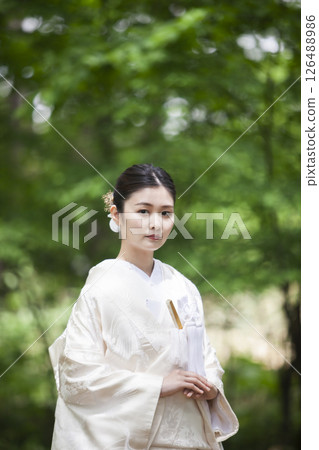 Bride wearing white dress Bride wearing white dress 126488986