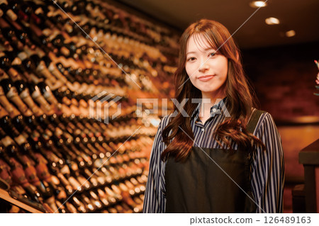 Wine cellar and female sommelier Wine cellar and female sommelier 126489163