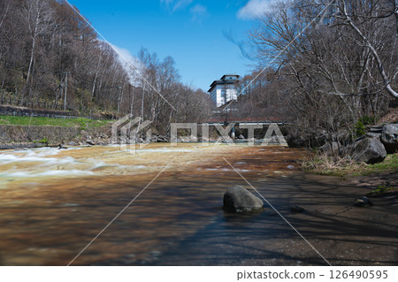Landscape with melting snow and a bridge 126490595