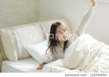 Sleepy woman in bed 126490688