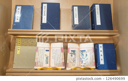 Chinese classical medical books on wooden shelves in Shanghai Ancient Books Store 126490699
