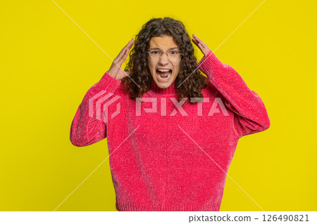 Irritated angry teenager child girl screams from stress tension problems shock rage nervous quarrel 126490821