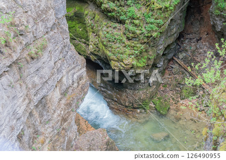 Waterfall, Rocks, Forest - View of a Waterfall Flowing Through a Gorge in a Forest. 126490955