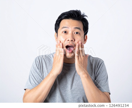 Japanese man with open mouth and surprised expression 126491234
