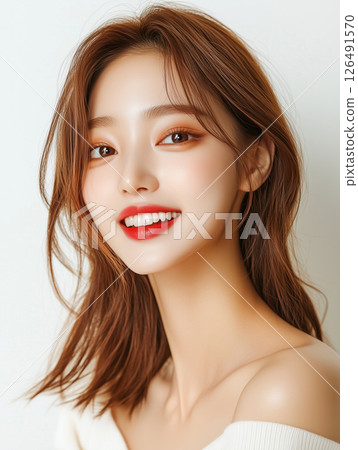 Young Korean woman with stylish hair and bright makeup smiling for the camera Young Korean woman with stylish hair and bright makeup smiling for the camera 126491570
