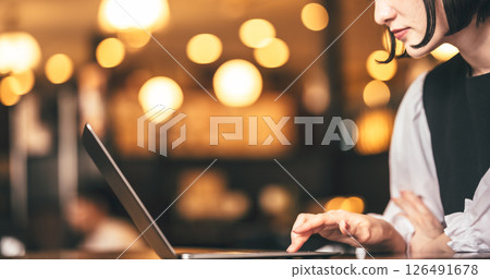 A woman working on a PC A woman working on a PC 126491678