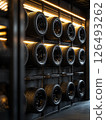 Upscale garage tire display featuring modern and stylish black tires arranged in organized rows with ambient lighting 126493262
