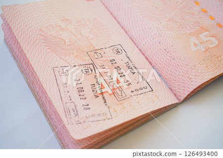 The real page of the foreign passport of citizen of Russian Federation, , migration law, foreign travel, obtaining visa, passport control at border 126493400