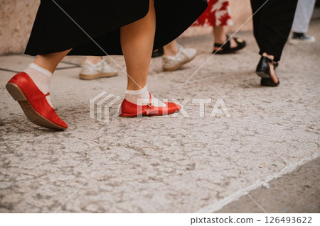 Colorful Shoes on City Street During a Casual Walk Colorful Shoes on City Street During a Casual Walk 126493622