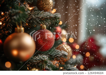 Festive Christmas tree adorned with colorful ornaments and soft snowflakes falling gently Festive Christmas tree adorned with colorful ornaments and soft snowflakes falling gently 126494684