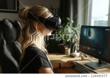 Employee Using Virtual Reality Headset for Remote Work and Immersive Experience at Home Employee Using Virtual Reality Headset for Remote Work and Immersive Experience at Home 126495577