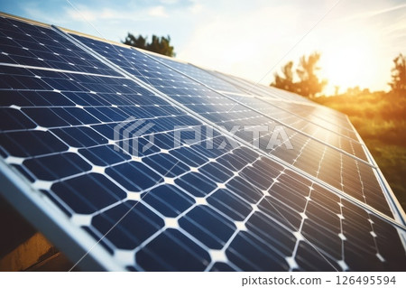 Solar Panel Array Captured in Golden Hour Light with Beautiful Nature Background in Distance 126495594