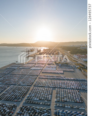 New Cars on Parking Lot in Port of Setubal, Portugal at Sunset. Aerial View New Cars on Parking Lot in Port of Setubal, Portugal at Sunset. Aerial View 126495737