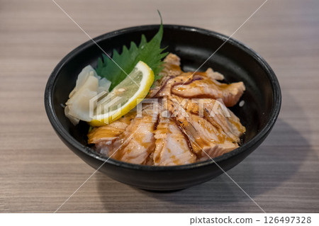 Grilled Salmon with rice, served in a bowl in the restaurant 126497328