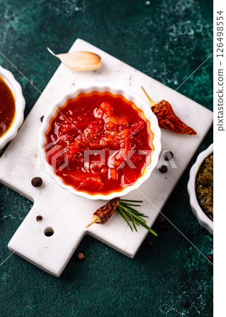 Set of different sauces. Ketchup, mustard, pesto 126498554