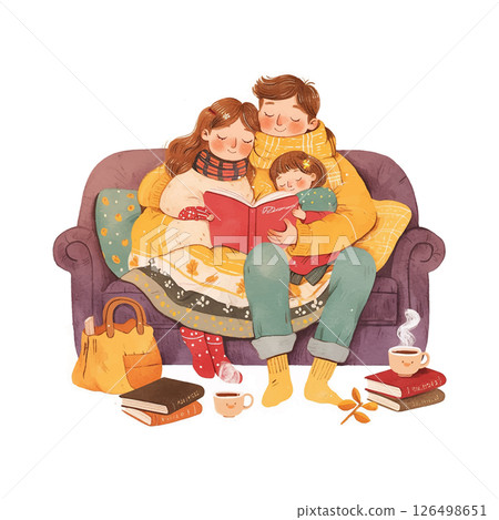 Cozy family reading time on a couch with warm blankets and cups of tea during a winter evening 126498651