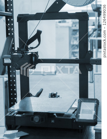 Empty working surface of 3D printer. 3D printer not working. Desktop 3D printer without printing process. Empty working surface of 3D printer. 3D printer not working. Desktop 3D printer without printing process. 126499036