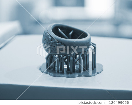 Abstract round art object printed on 3D printer from photopolymer. Model printed on 3D printer from liquid photopolymer resins. SLA 3D printing technology. Printing technology. 126499066