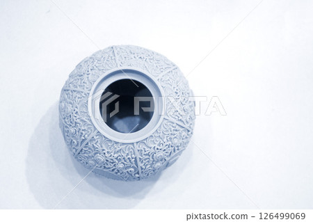 Abstract round art object printed on 3D printer from photopolymer on a white background. Model printed on 3D printer from liquid photopolymer resins. SLA 3D printing technology. Printing technology. Abstract round art object printed on 3D printer from photopolymer on a white background. Model printed on 3D printer from liquid photopolymer resins. SLA 3D printing technology. Printing technology. 126499069