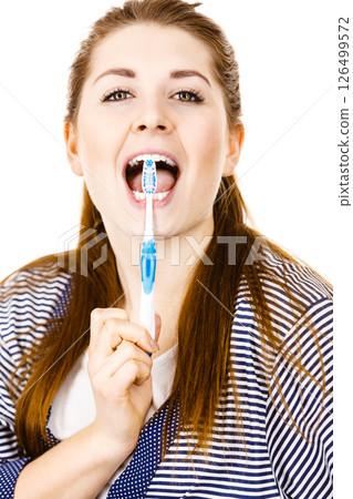 Woman brushing cleaning teeth. Woman brushing cleaning teeth. 126499572