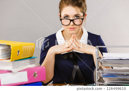 Confident business woman in office Confident business woman in office 126499610