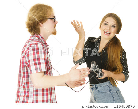 Woman controling man using gaming pad 126499879
