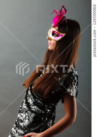 woman with carnival mask on gray woman with carnival mask on gray 126500068