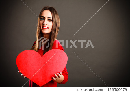 Valentines Day woman holding heart. 126500079